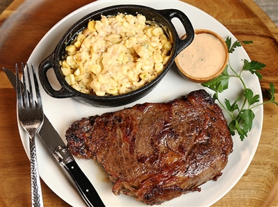 Rube's Black Angus wet-aged ribeye with a jalapeno corn side dish.