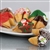 Traditional vanilla fortune cookies covered in chocolate and hand decorated with holiday sprinkles.