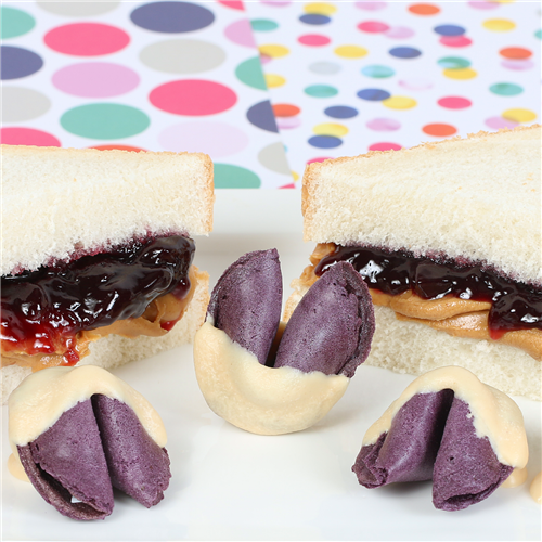 Grape jelly flavored fortune cookies, dipped in peanut butter chocolate with a gooey grape jelly center.