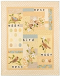 Soft quilt with sweet applique birds, flowers, eggs and a nest