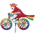 Large Parrot On A Bicycle Garden Spinner with colorful wheels that spin in a gentle breeze. All hardware included.