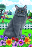 Grey Maine Coon cat sitting in the grass with flowers garden flag.