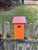 Orange Blue Bird House with a purple roof made of composite material.  Hand made by a craftsman in the USA.