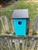 Teal Blue Bird House with a black roof made of composite material.  Hand made by a craftsman in the USA.