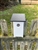 White Blue Bird House with a black roof made of composite material.  Hand made by a craftsman in the USA.