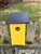 Yellow Blue Bird House with a black roof made of composite material.  Hand made by a craftsman in the USA.