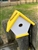 White Wren House with a yellow roof made of composite material.  Hand made by a craftsman in the USA.