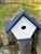 White Wren House with a navy roof made of composite material.  Hand made by a craftsman in the USA.