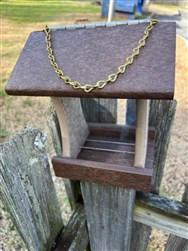 Tan And Brown Bird Feeder made of composite material. Holds 1 quart of seed. Hand made by a craftsman in the USA.