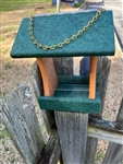 Cedar And Green Bird Feeder made of composite material. Holds 1 quart of seed. Hand made by a craftsman in the USA.