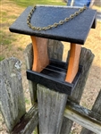 Cedar And Green Bird Feeder made of composite material. Holds 1 quart of seed. Hand made by a craftsman in the USA.