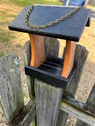 Cedar And Green Bird Feeder made of composite material. Holds 1 quart of seed. Hand made by a craftsman in the USA.