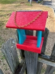 Teal And Orange Bird Feeder made of composite material. Holds 1 quart of seed. Hand made by a craftsman in the USA.
