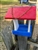 Red White And Blue Bird Feeder made of composite material. Holds 1 quart of seed. Hand made by a craftsman in the USA.