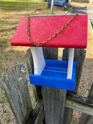 Red White And Blue Bird Feeder made of composite material. Holds 1 quart of seed. Hand made by a craftsman in the USA.