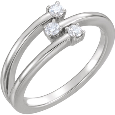 A 14k white gold split shank ring with three round diamond set vertically in this beautiful and unique diamond ring.