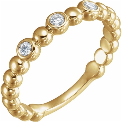 This 14k yellow gold diamond stackable ring features round diamonds.