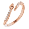 A 14k rose gold diamond snake ring with round brilliant diamond accents.