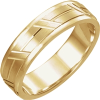 A 14k gold men's wedding band with grooves.