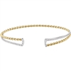 This 14k yellow gold cuff bangle bracelet features a beaded 14k white gold front section connected by a 14k yellow gold twisted rope.