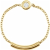 A 14k yellow gold link chain connects to a diamond set bezel in this 14k yellow ring.