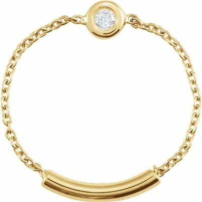 A 14k yellow gold link chain connects to a diamond set bezel in this 14k yellow ring.