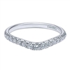 This 14k white gold diamond wedding band is curved.