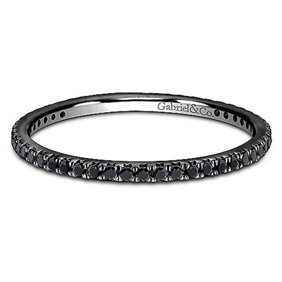 A 14k black gold and black diamond stackable ring.