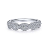 This 14k white gold diamond wedding ring features over one half carat of marquise and round diamonds.