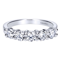 Round brilliant diamonds fill this 14k white gold wedding band with 0.99 carats of diamond shine.