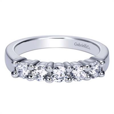 This 5 stone diamond wedding band features 3/4 carats of diamond shine set against the sleek 14k white gold setting, giving this diamond wedding band its contemporary appeal.