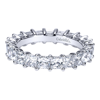 This 14k white gold princess cut diamond eternity band features 3.5 carats of princess cut diamonds all wrapping around 14k white gold.