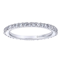 This 14k white gold diamond eternity band uses over one half carats of round brilliant diamonds to wrap around 14k white gold in this never-ending diamond band!