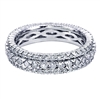 This 14k white gold diamond eternity band features 1,40 carats of round brilliant diamonds with three rows of round brilliant diamonds.
