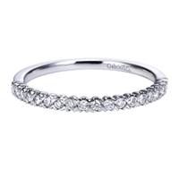 This white gold diamond wedding band astounds with round brilliant diamonds and a bold and refined look.