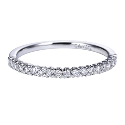 This white gold diamond wedding band astounds with round brilliant diamonds and a bold and refined look.