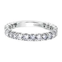 Sultry round diamonds glisten along her finger with over 1 carat of round diamonds shimmering in this unique white gold diamond band!