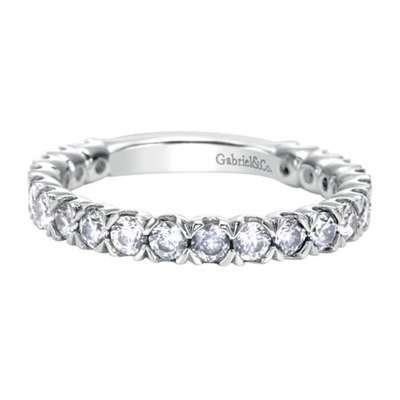 Sultry round diamonds glisten along her finger with over 1 carat of round diamonds shimmering in this unique white gold diamond band!
