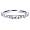 One half carats of round brilliant diamonds make their way around a 14k white gold diamond wedding band in this uplifted classic!