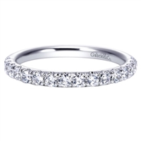 One half carats of round brilliant diamonds make their way around a 14k white gold diamond wedding band in this uplifted classic!