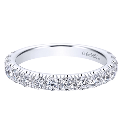 Diamonds wrap themselves three quarters around a 14k white gold band in this classic diamond wedding band.