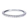 Round brilliant diamonds wrap 3/4 of the way around a shimmering 14k white gold ring in this white gold diamond wedding band with one third carats of round brilliant diamond shine.