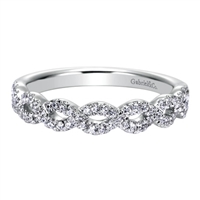This 14k white gold diamond wedding band features white gold bands that loop around one another for a beautiful effect!
