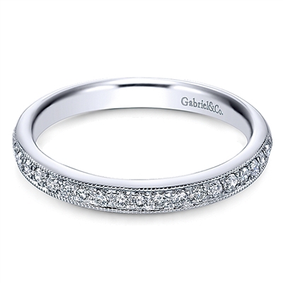 This milgrained 14k white gold diamond band features 0.26 carats of round brilliant diamonds.