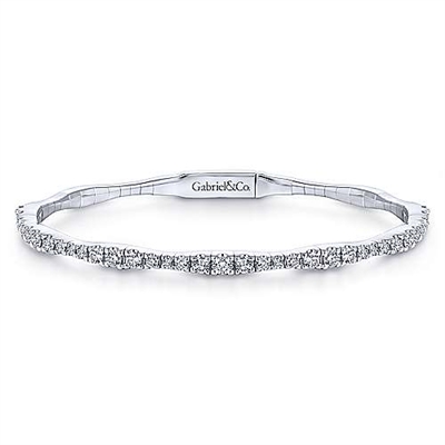 This bangle bracelet features a unique style and flair with over 1 carat of round brilliant diamonds that are set into gorgeous 14k white gold.