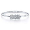 This white gold diamond bangle with a vintage style features nearly one half carats of round brilliant diamond shimmer.