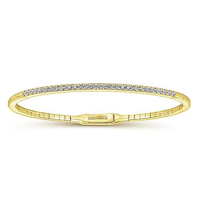 This 14k yellow gold diamond bangle features over one half carats of diamonds in a flexible