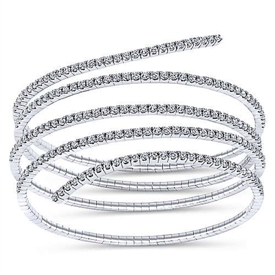 A swirling 14k white gold diamond bangle with over 2 carats of diamond splendor.