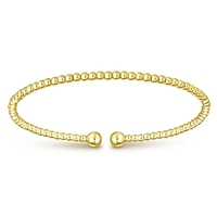 This 14k yellow gold cuff bangle bracelet is beautiful.