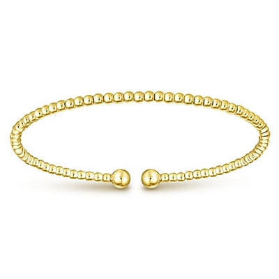 This 14k yellow gold cuff bangle bracelet is beautiful.